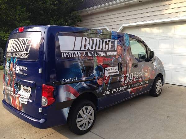 Photo of a Budget Heating and Cooling Van sitting in a driveway